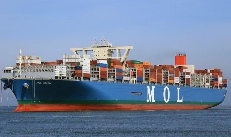 MOL Truth built in 2017 with a carrying capacity of 20,182 TEU. She is sailing under the Panama flad with IMO number 9773210.  Vessel is owned and operated by Mitsui O.S.K. Lines, Ltd. (MOL) registered in Japan. Ship construction was done at the Saijo Shipyard of Imabari Shipbuilding Co., Ltd. MOL Truth was the 1st containership over 20,000 TEU capacity built in Japan. She has a loading capacity of 20,182 TEU and sail under “THE” alliance.
Low-friction hull paint, a high-efficiency propeller and PBCF, a high-efficiency engine plant, and an optimized hull shape are some features of MOL Truth to minimise her environmetal impact while in operation. These features will reduce CO2 emissions by 25-30% per container when compared to MOL-operated 14,000 TEU class vessels.
vessel dimension LOA: 400 m, Breadth: 58.5m, Depth: 32.9 m.
dailylogistic.com, daily logistic, dailylogistics, daily logistics